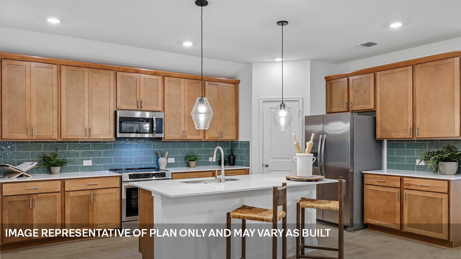 244 Rivers Edge Drive Georgetown, TX 78628 - Photo 16 of 37 a kitchen with stainless steel appliances granite countertop a refrigerator a sink dishwasher a dining table and chairs with wooden floor