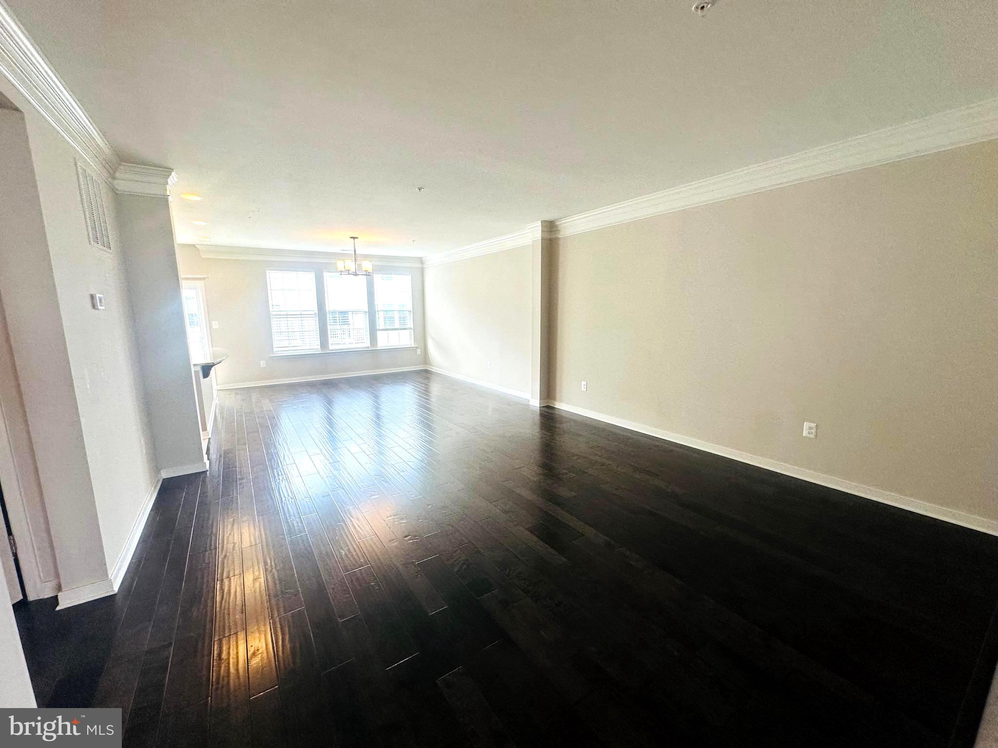 25576 Tolar Square Chantilly, VA 20152 - Photo 16 of 55 an empty room with wooden floor and windows