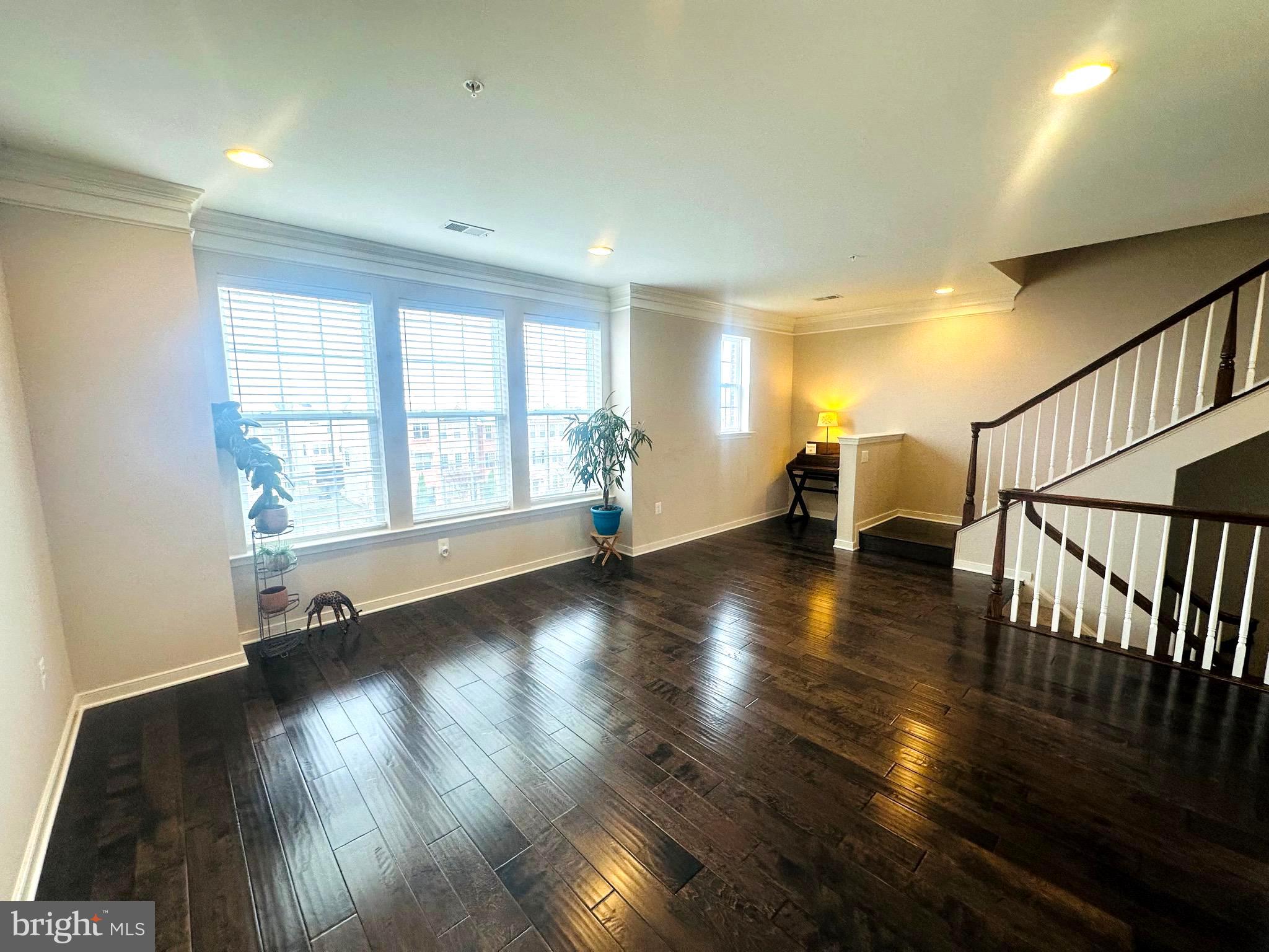 25576 Tolar Square Chantilly, VA 20152 - Photo 21 of 55 an empty room with wooden floor and windows