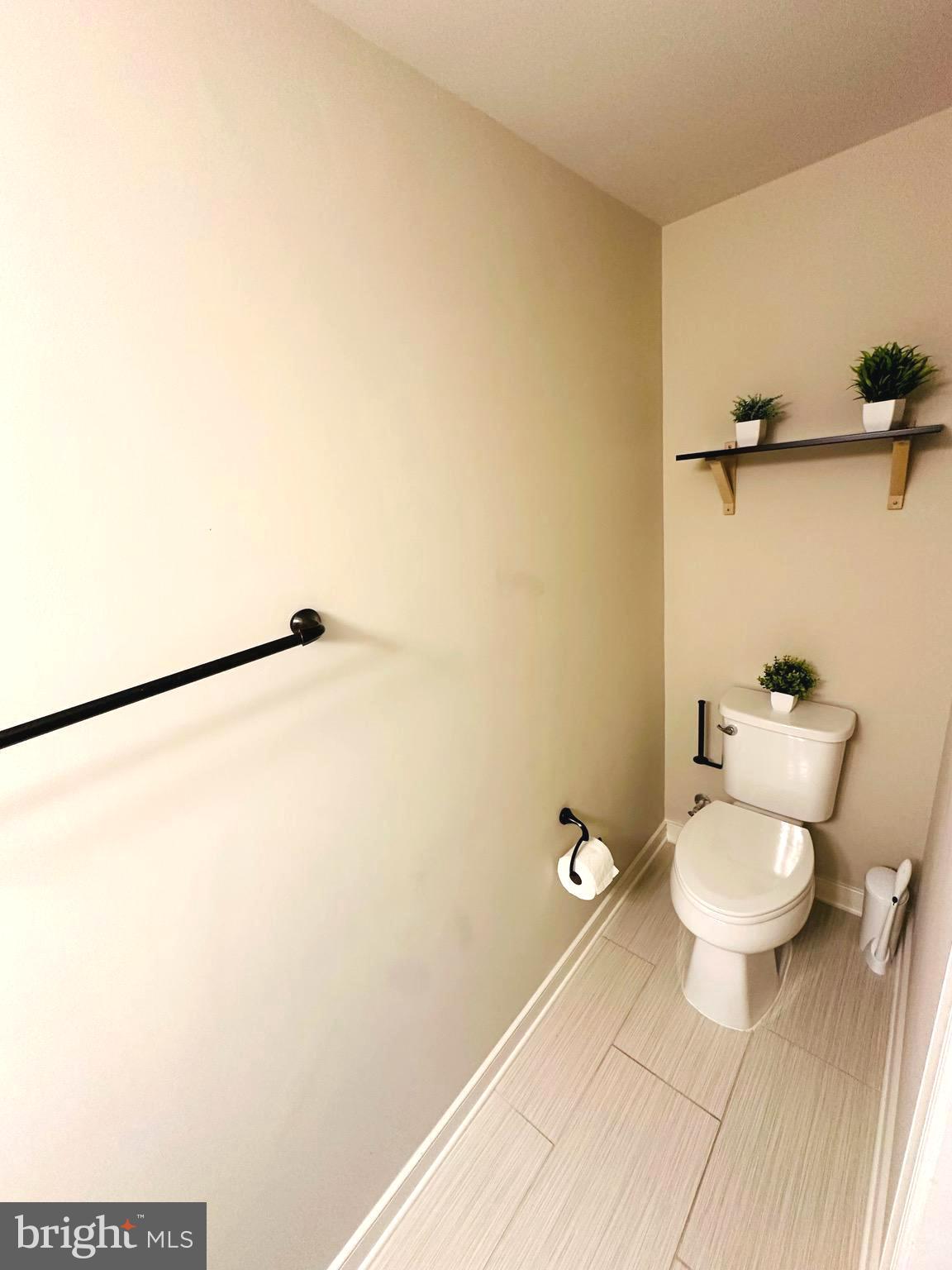 25576 Tolar Square Chantilly, VA 20152 - Photo 24 of 55 a bathroom with a toilet and a shower