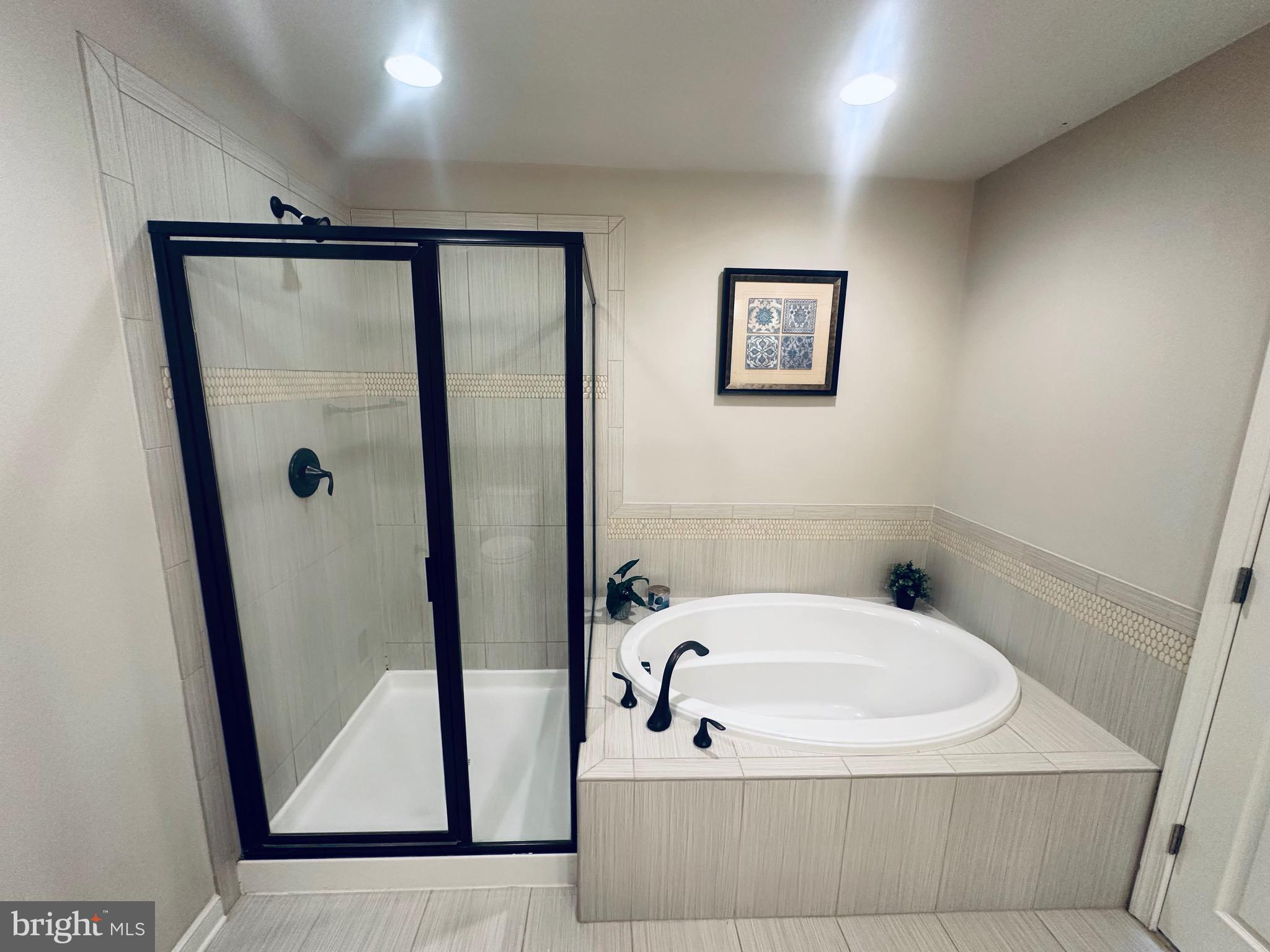 25576 Tolar Square Chantilly, VA 20152 - Photo 29 of 55 a bathroom with a tub and shower