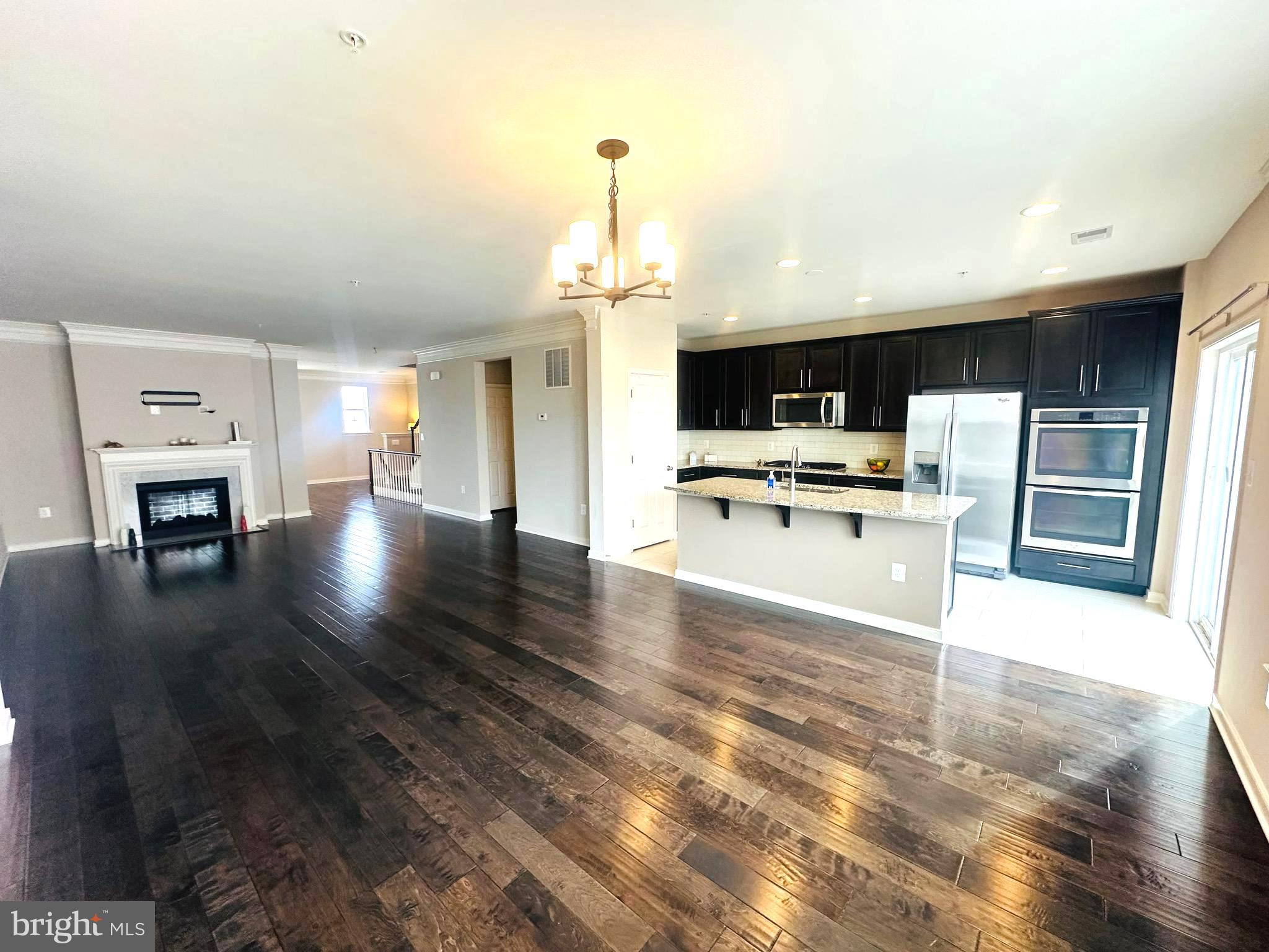25576 Tolar Square Chantilly, VA 20152 - Photo 7 of 55 a view of kitchen with furniture and wooden floor
