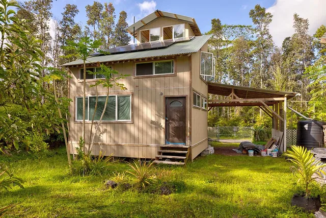 a view of a house with a yard balcony