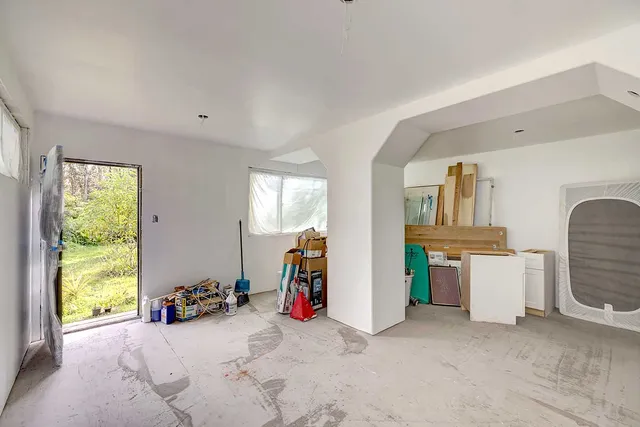 a view of a room with gym equipment and windows