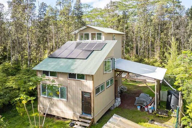 a aerial view of a house with a yard