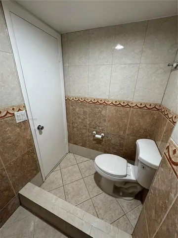 a bathroom with a double vanity sink and mirror