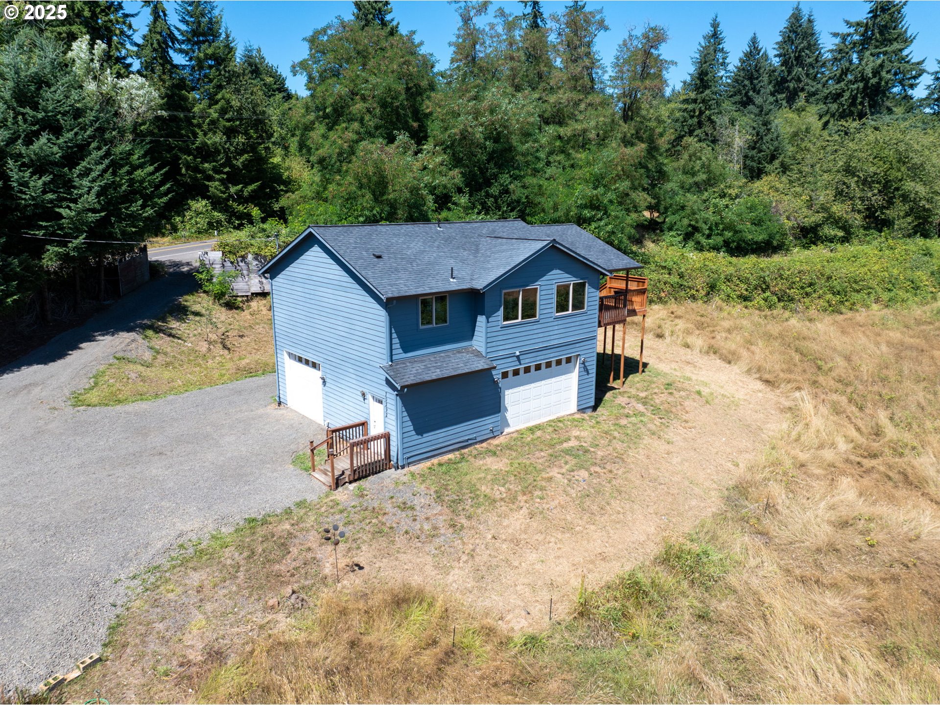 70292 Walker Road Rainier, OR 97048 - Photo 1 of 40 a view of a house with a yard and sitting area