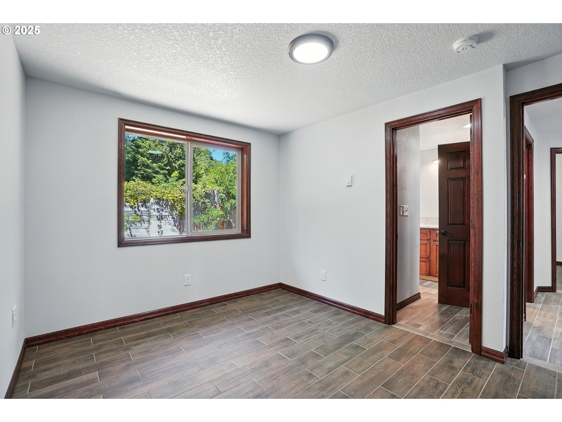 70292 Walker Road Rainier, OR 97048 - Photo 17 of 40 an empty room with wooden floor and windows