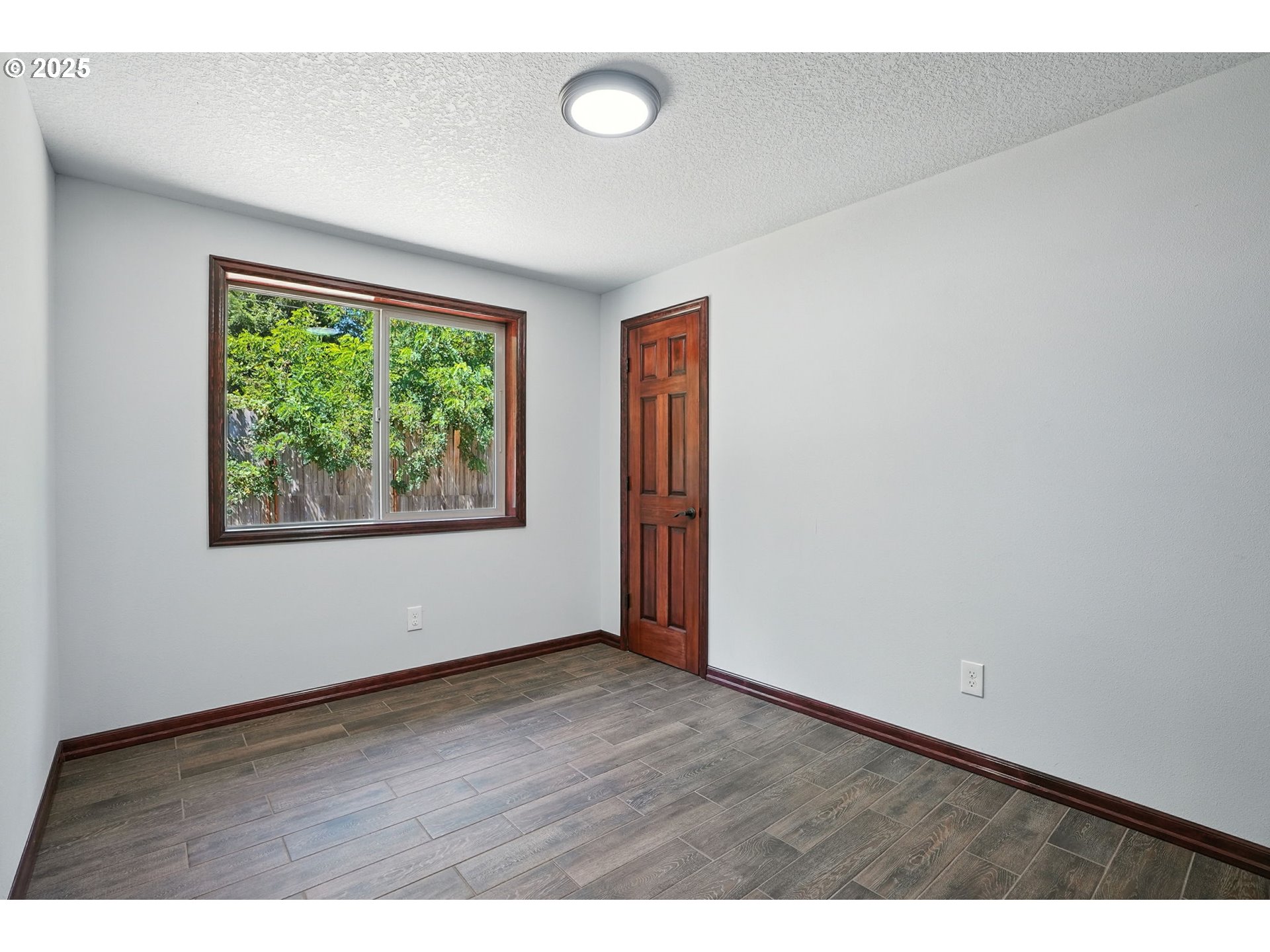 70292 Walker Road Rainier, OR 97048 - Photo 23 of 40 an empty room with wooden floor and windows