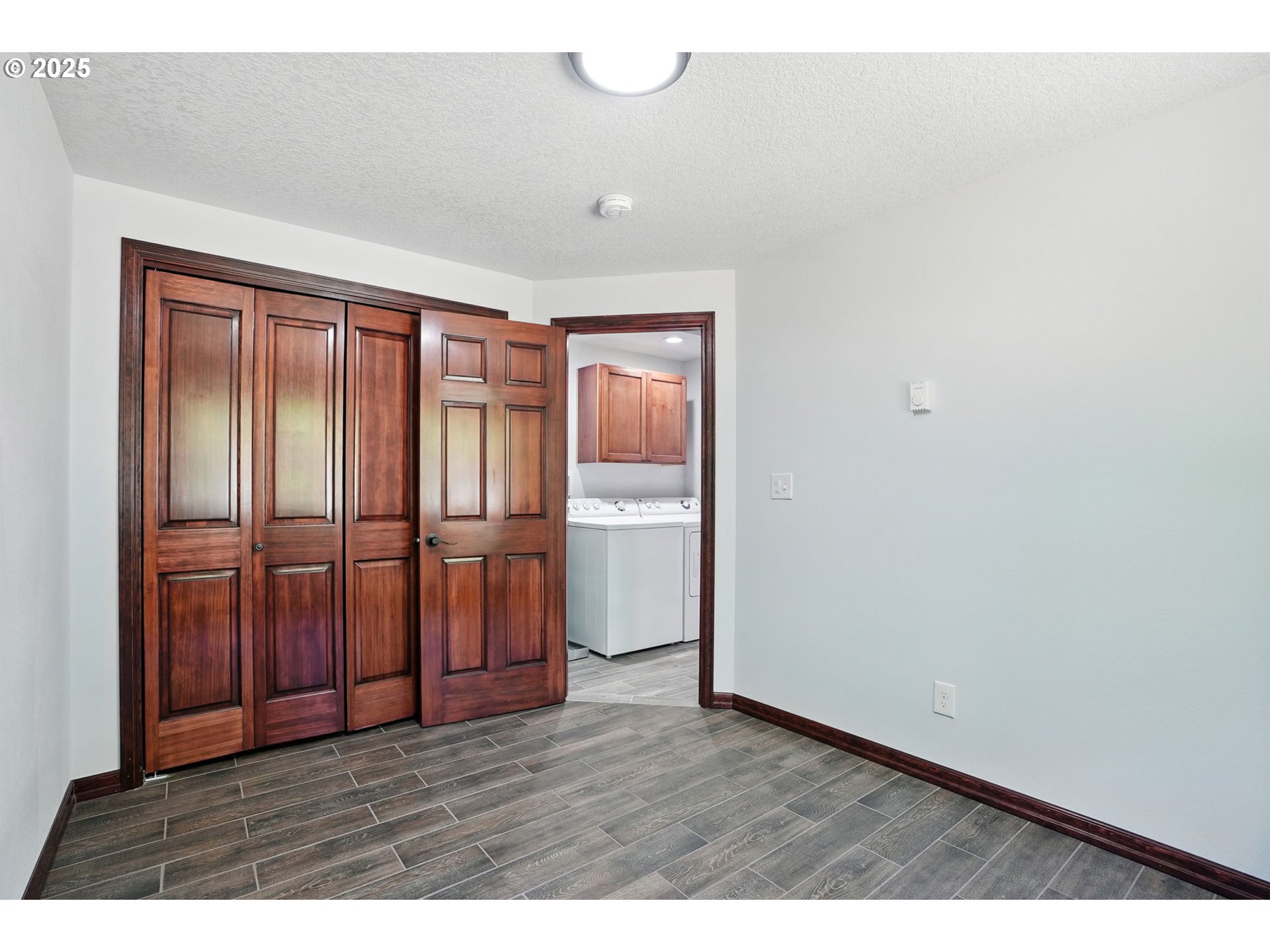 70292 Walker Road Rainier, OR 97048 - Photo 24 of 40 a view of an empty room with wooden floor