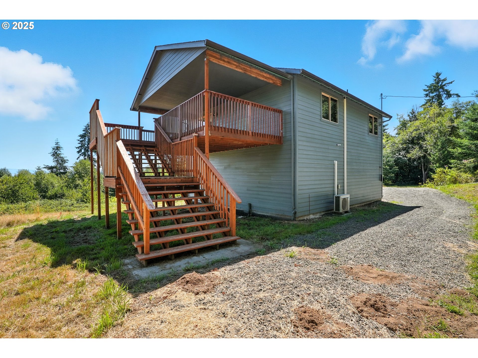70292 Walker Road Rainier, OR 97048 - Photo 28 of 40 a front view of a house with a yard