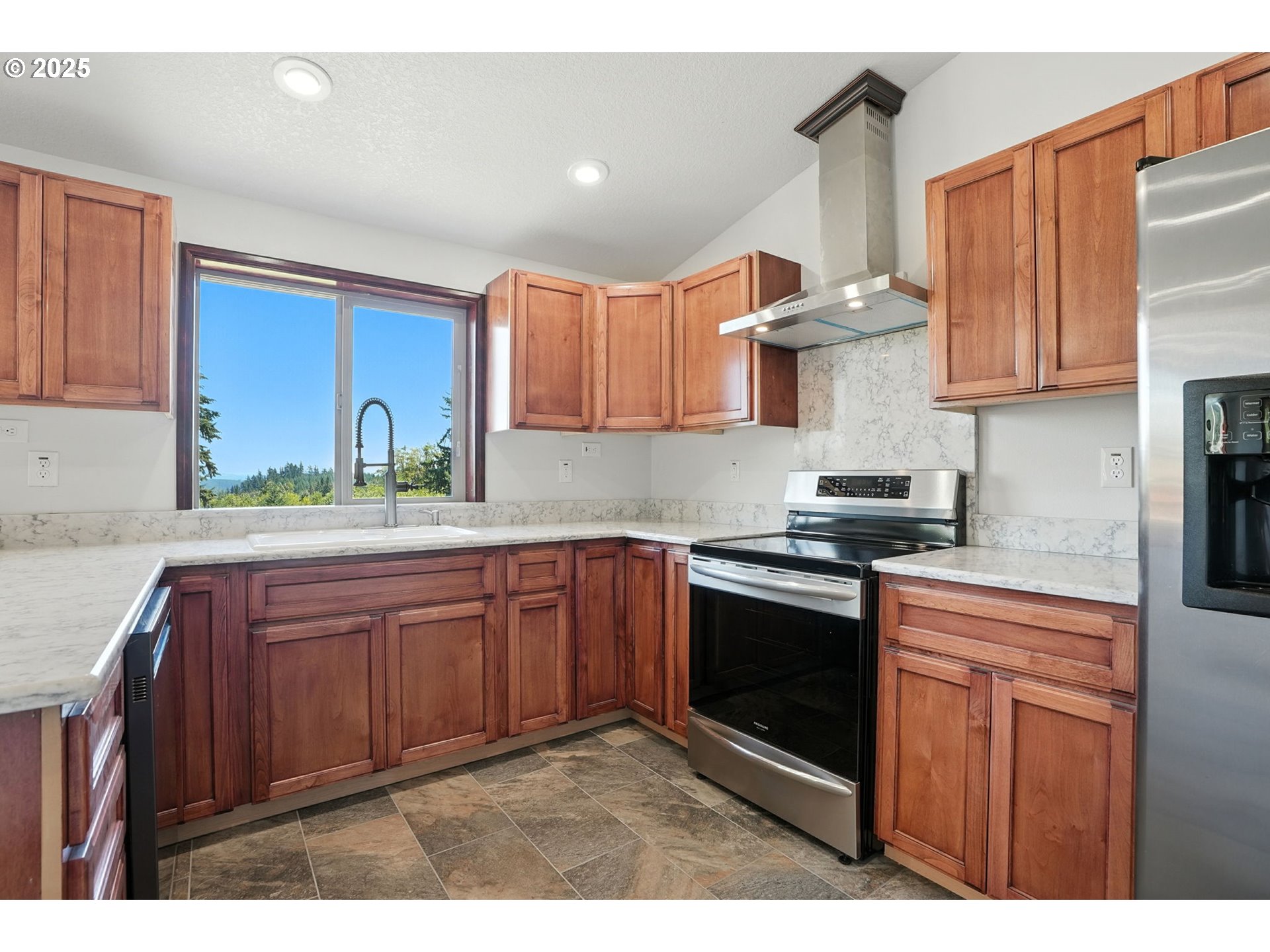 70292 Walker Road Rainier, OR 97048 - Photo 7 of 40 a kitchen with stainless steel appliances granite countertop a stove a sink dishwasher and cabinets