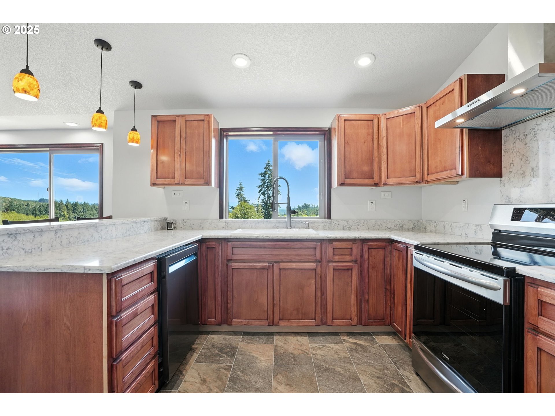 70292 Walker Road Rainier, OR 97048 - Photo 8 of 40 a kitchen with kitchen island granite countertop a sink cabinets and window