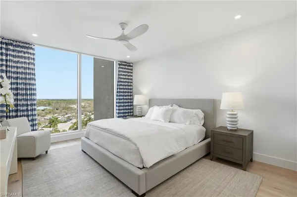 a bedroom with a bed and a couch
