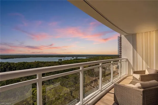 a view of balcony with furniture