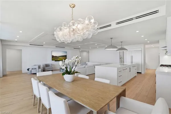 a kitchen with a table and chairs in it