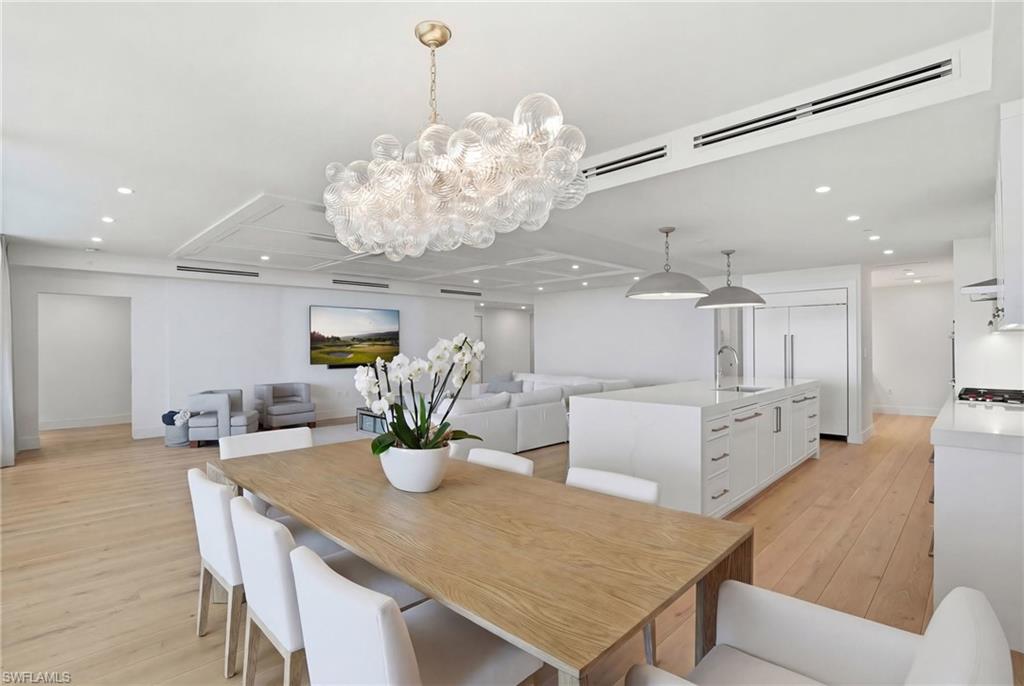 13945 Old Coast Road, Unit 803 Naples, FL 34110 - Photo 7 of 37 a kitchen with a table and chairs in it