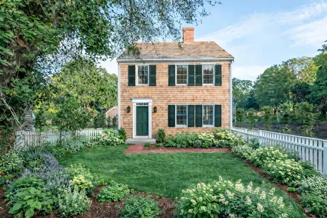 an aerial view of a house with a garden