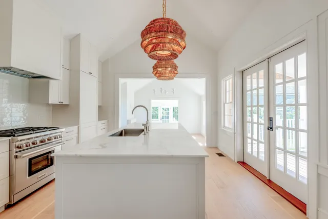 a kitchen with a sink and cabinets