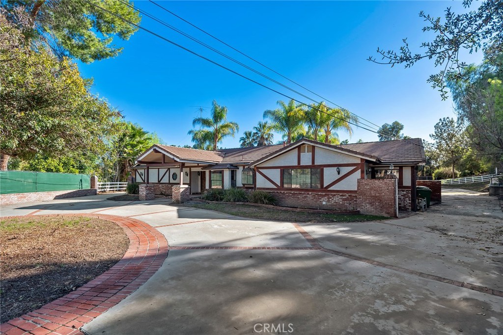 5546 Paradise Valley Road Hidden Hills, CA 91302 - Photo 11 of 14 a view of a house with a yard