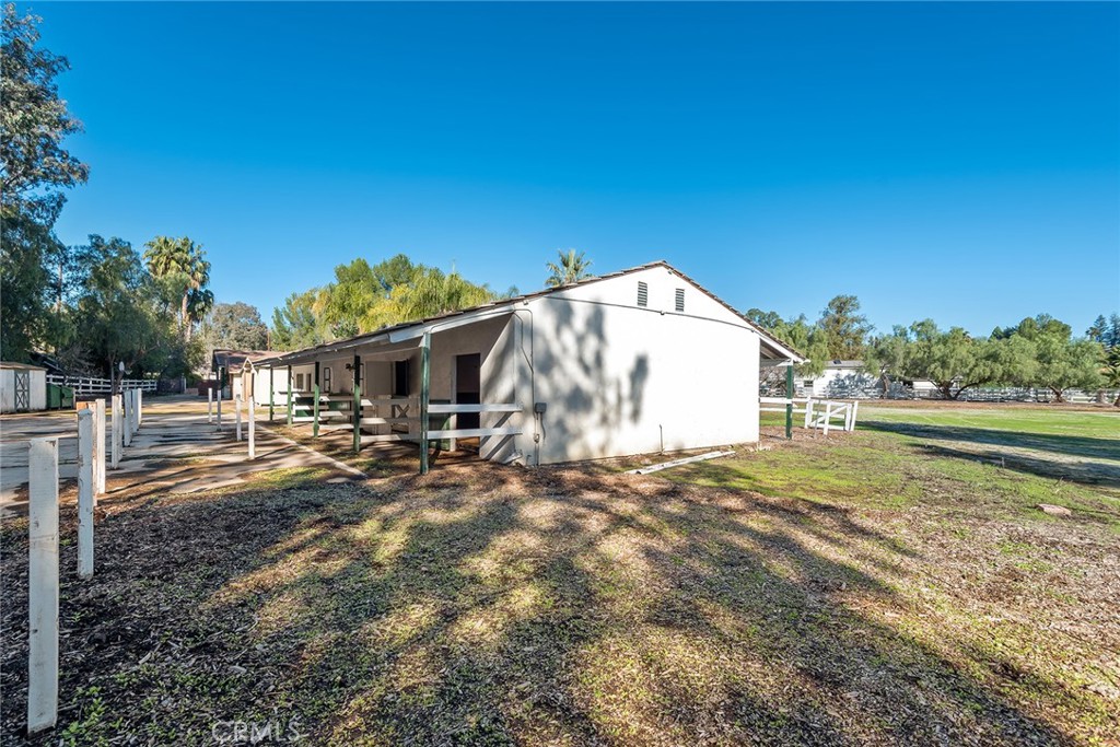 5546 Paradise Valley Road Hidden Hills, CA 91302 - Photo 12 of 14 a view of a dry yard with a house