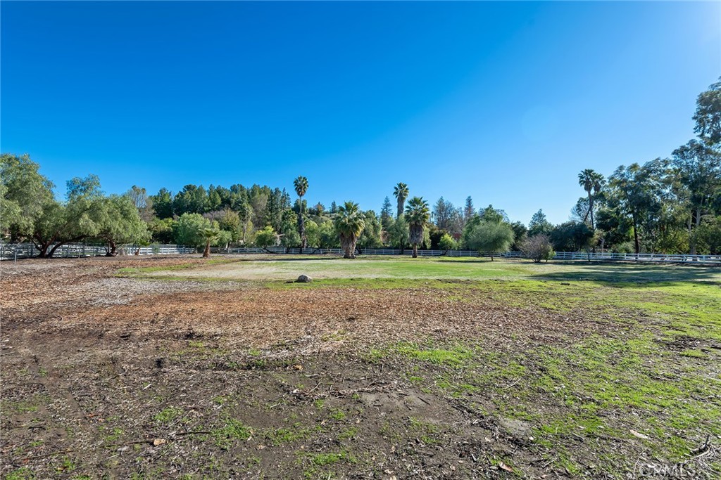 5546 Paradise Valley Road Hidden Hills, CA 91302 - Photo 8 of 14 a view of a field with trees in the background