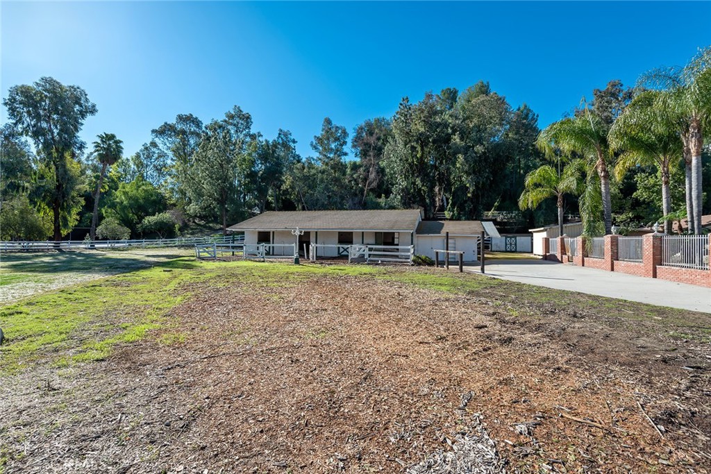 5546 Paradise Valley Road Hidden Hills, CA 91302 - Photo 9 of 14 a swimming pool with outdoor seating and yard