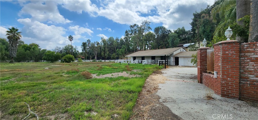 5546 Paradise Valley Road Hidden Hills, CA 91302 - Photo 10 of 14 a view of a house with a backyard