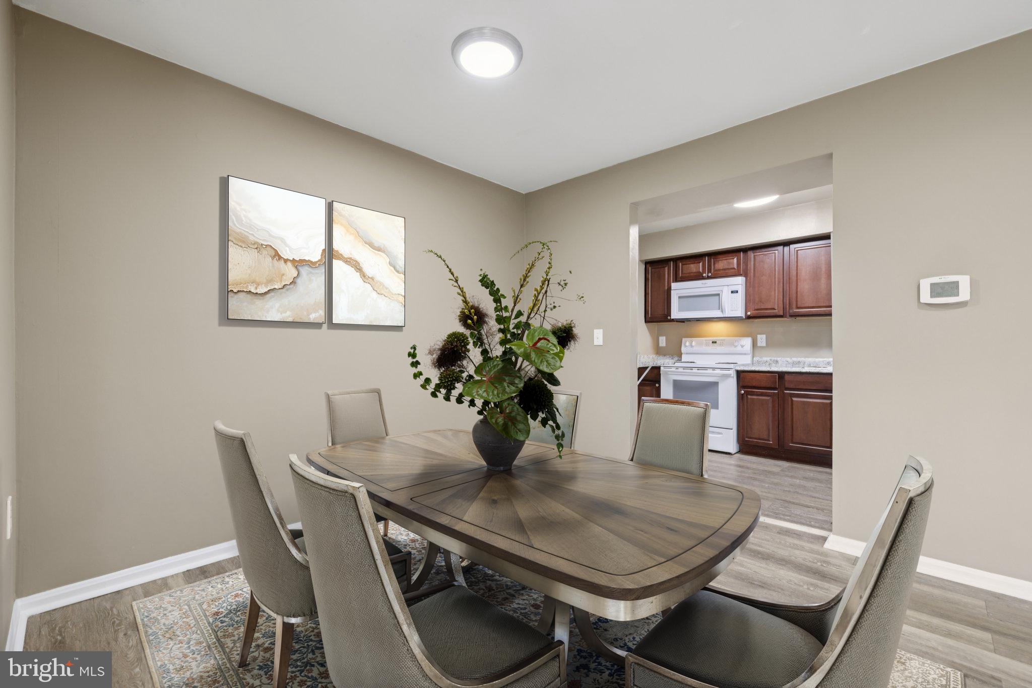 9075 North Laurel Road, Unit E Laurel, MD 20723 - Photo 12 of 28 a view of a dining room with furniture
