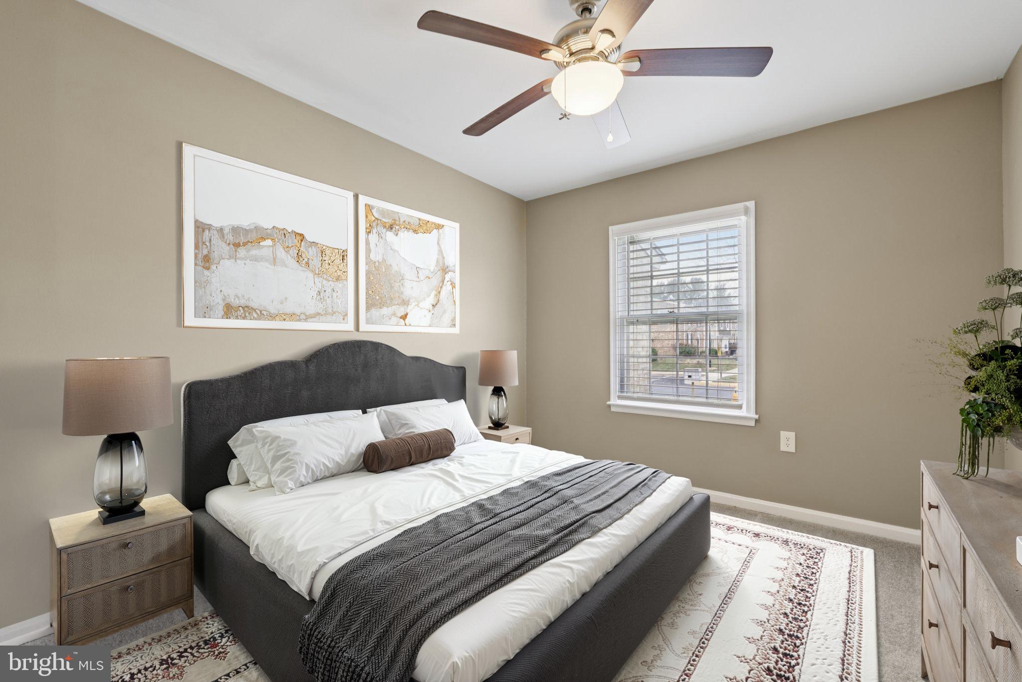 9075 North Laurel Road, Unit E Laurel, MD 20723 - Photo 21 of 28 a bedroom with a large bed and a window