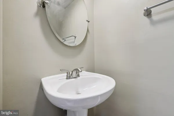 a bathroom with a sink and mirror