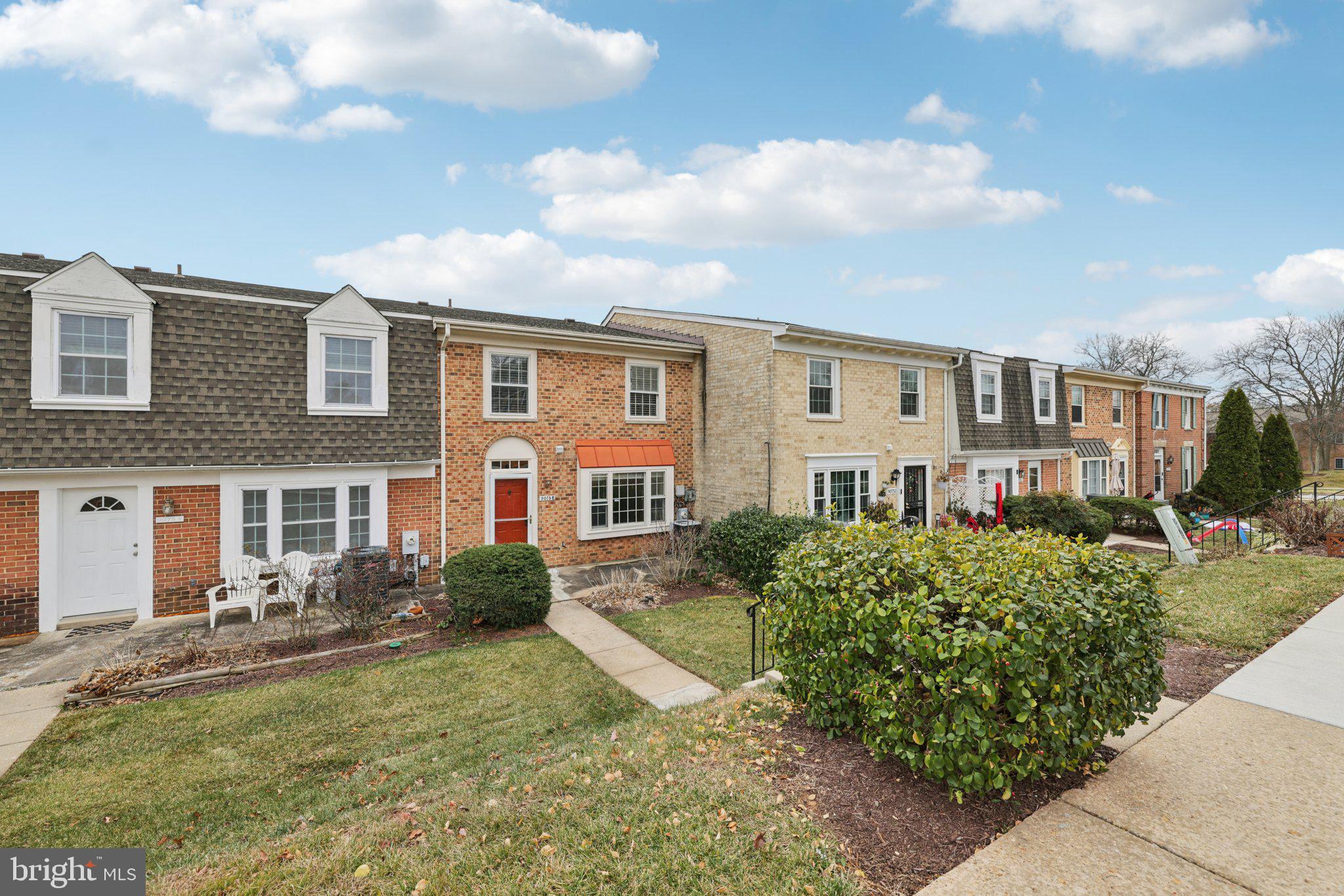 9075 North Laurel Road, Unit E Laurel, MD 20723 - Photo 4 of 28 a front view of a house with garden