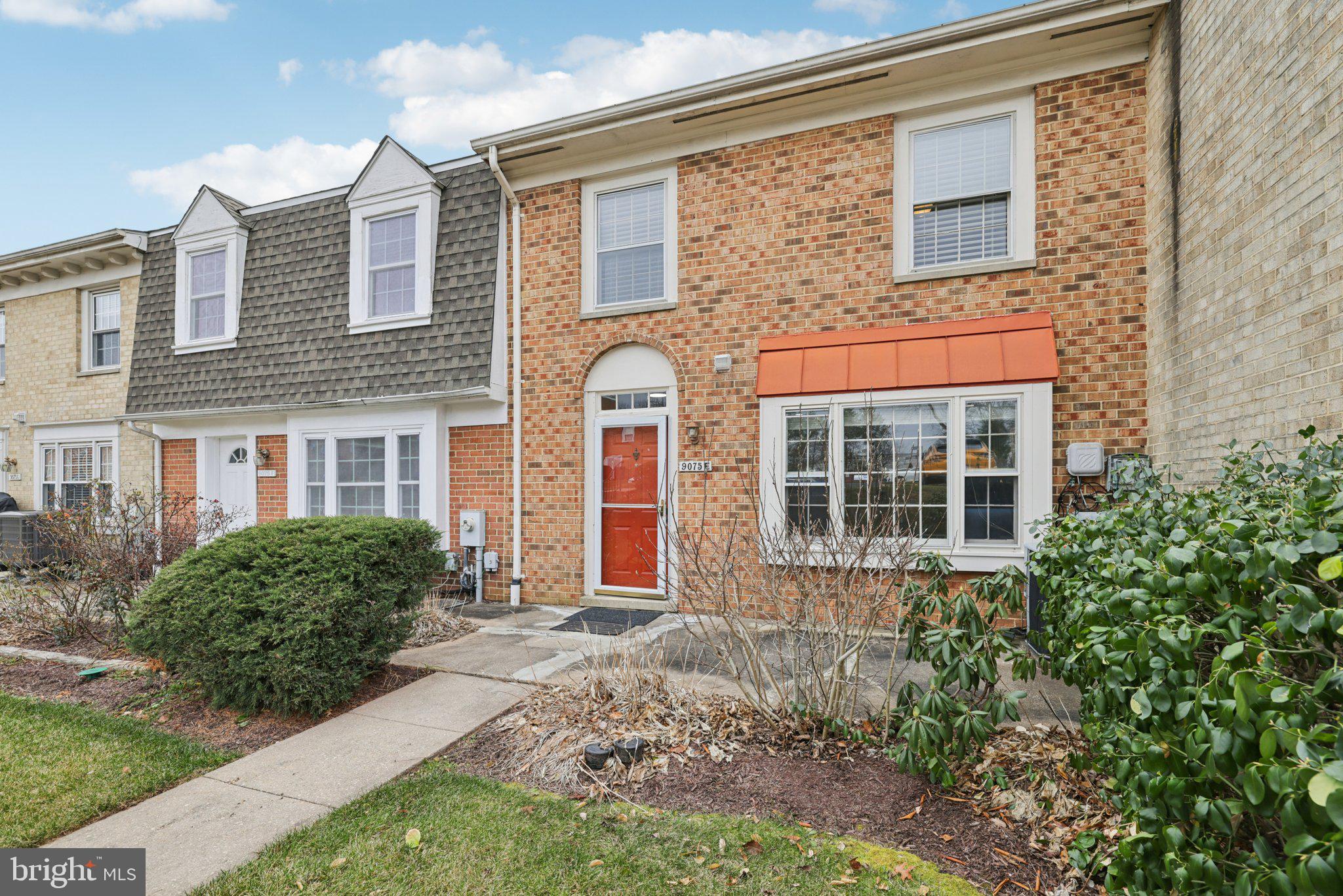 9075 North Laurel Road, Unit E Laurel, MD 20723 - Photo 5 of 28 front view of a brick house with a small yard