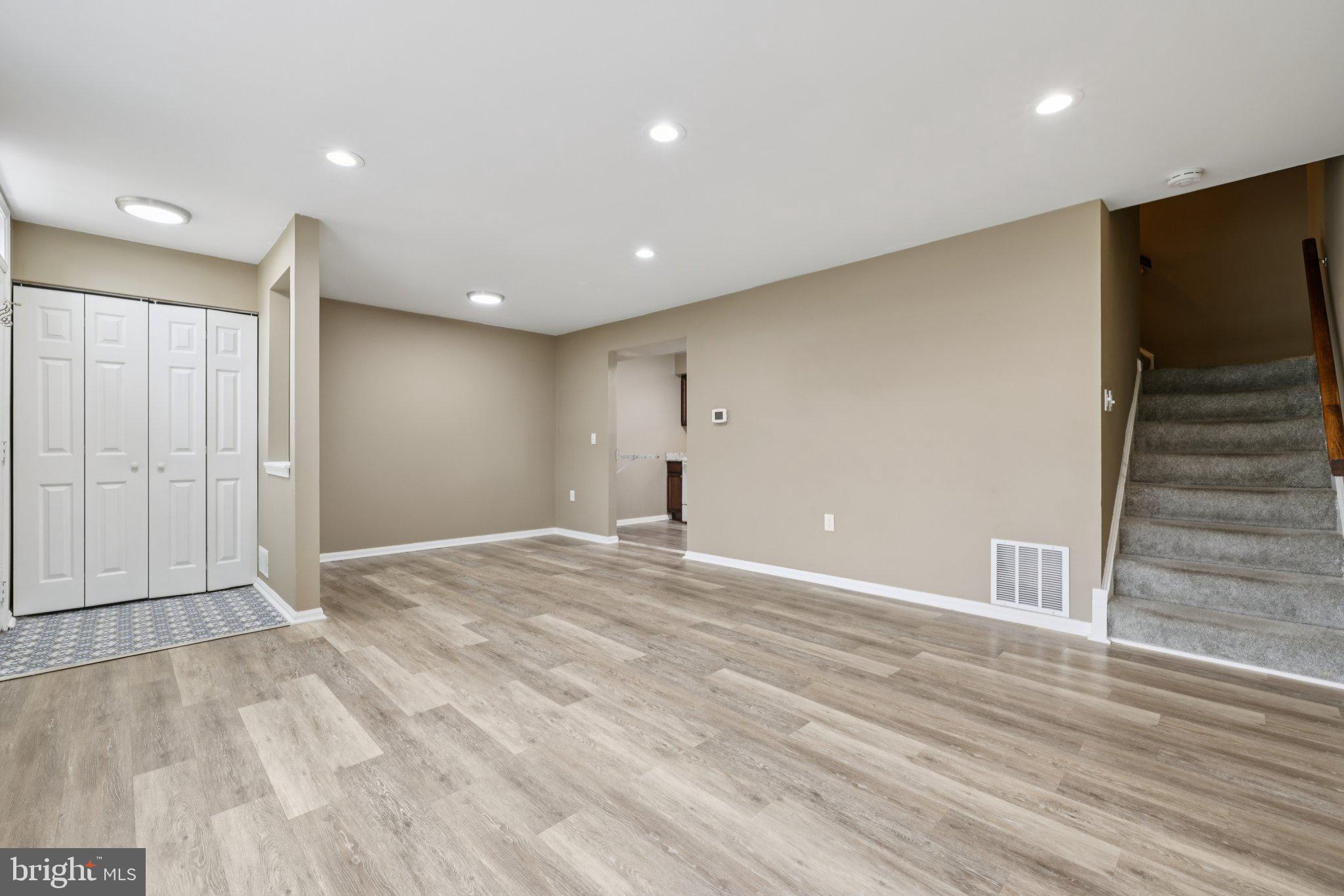 9075 North Laurel Road, Unit E Laurel, MD 20723 - Photo 9 of 28 a view of empty room with wooden floor