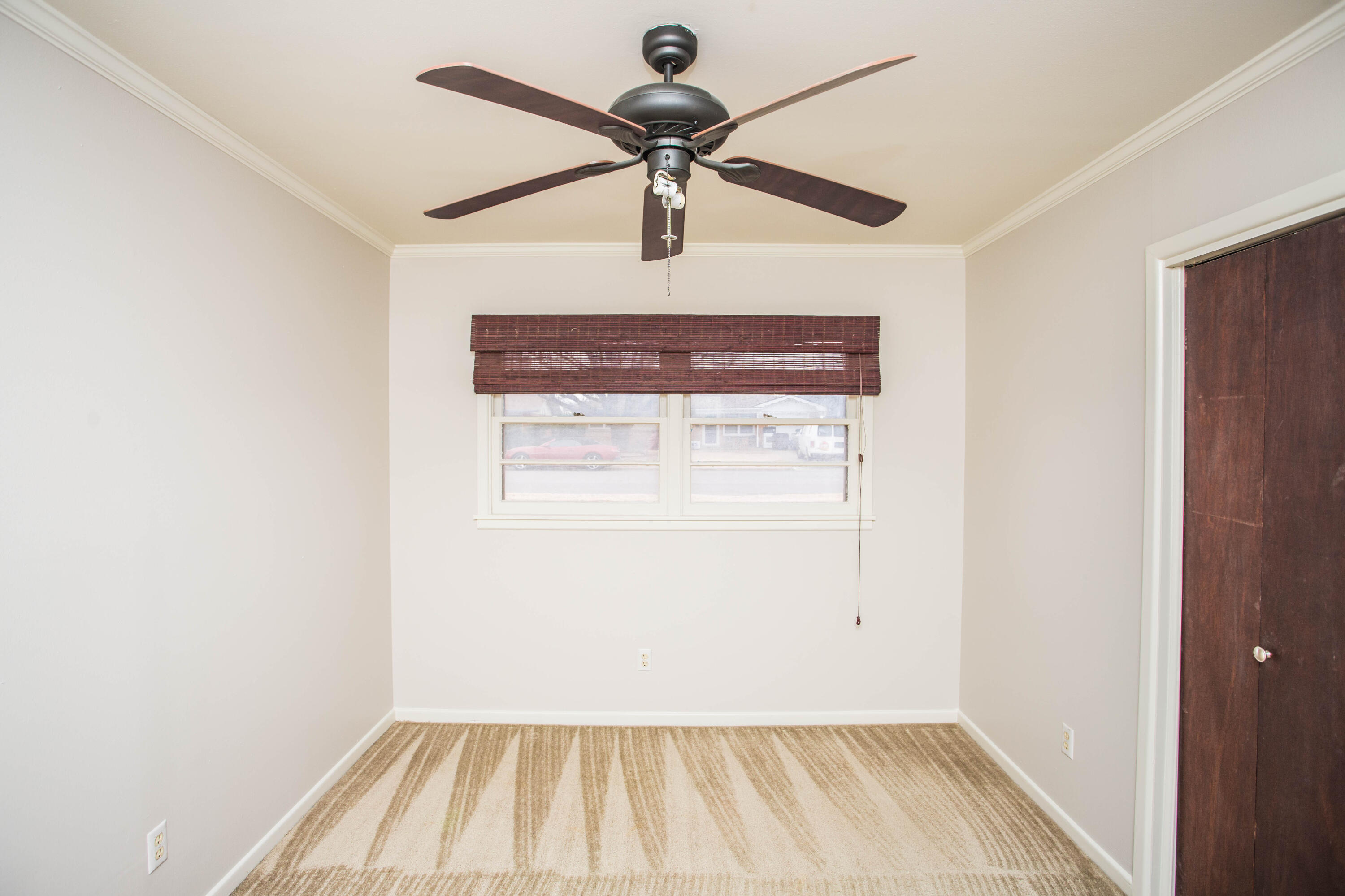 4932 9th Street Lubbock, TX 79416 - Photo 11 of 29 a view of room with window and wooden floor