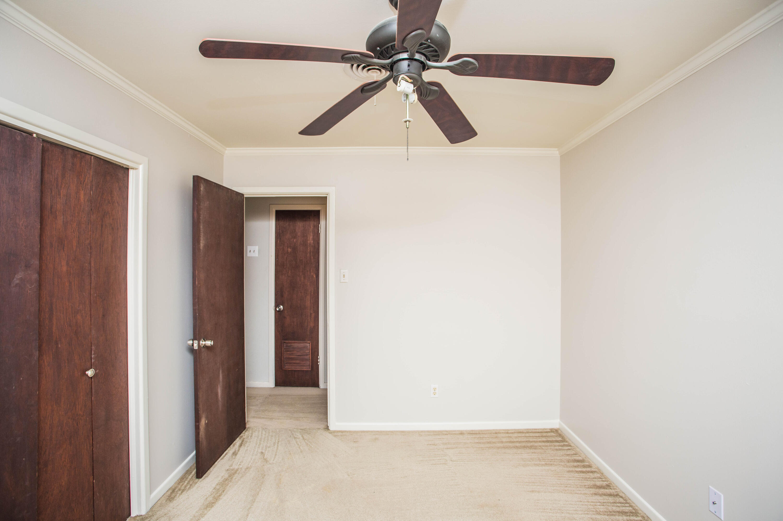 4932 9th Street Lubbock, TX 79416 - Photo 12 of 29 a view of a hallway with a ceiling fan