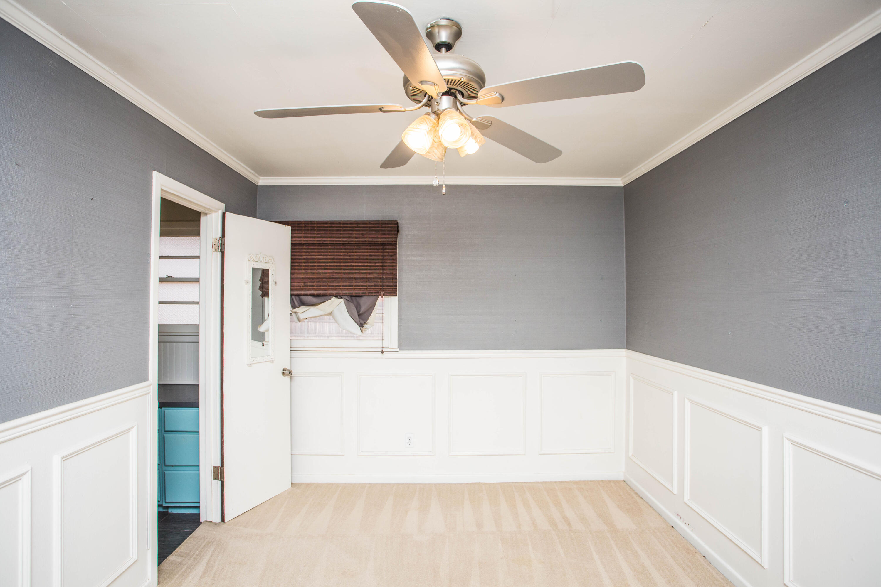 4932 9th Street Lubbock, TX 79416 - Photo 17 of 29 a view of hallway with a ceiling fan