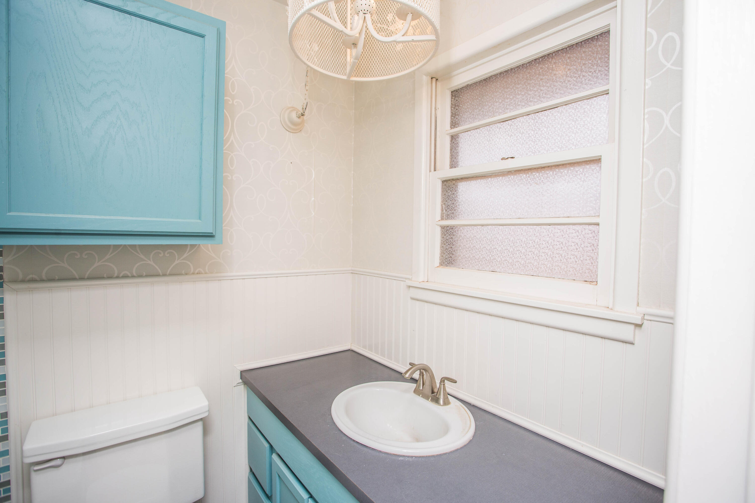 4932 9th Street Lubbock, TX 79416 - Photo 21 of 29 a bathroom with a sink and a toilet