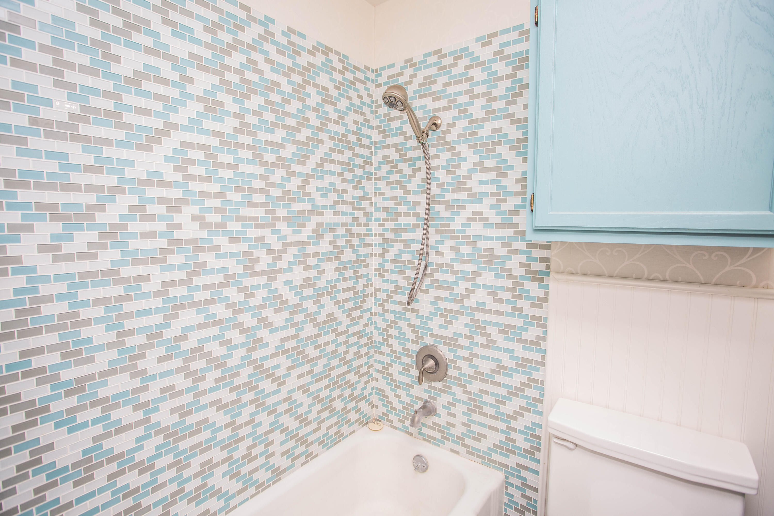 4932 9th Street Lubbock, TX 79416 - Photo 22 of 29 a bathroom with a bathtub and shower
