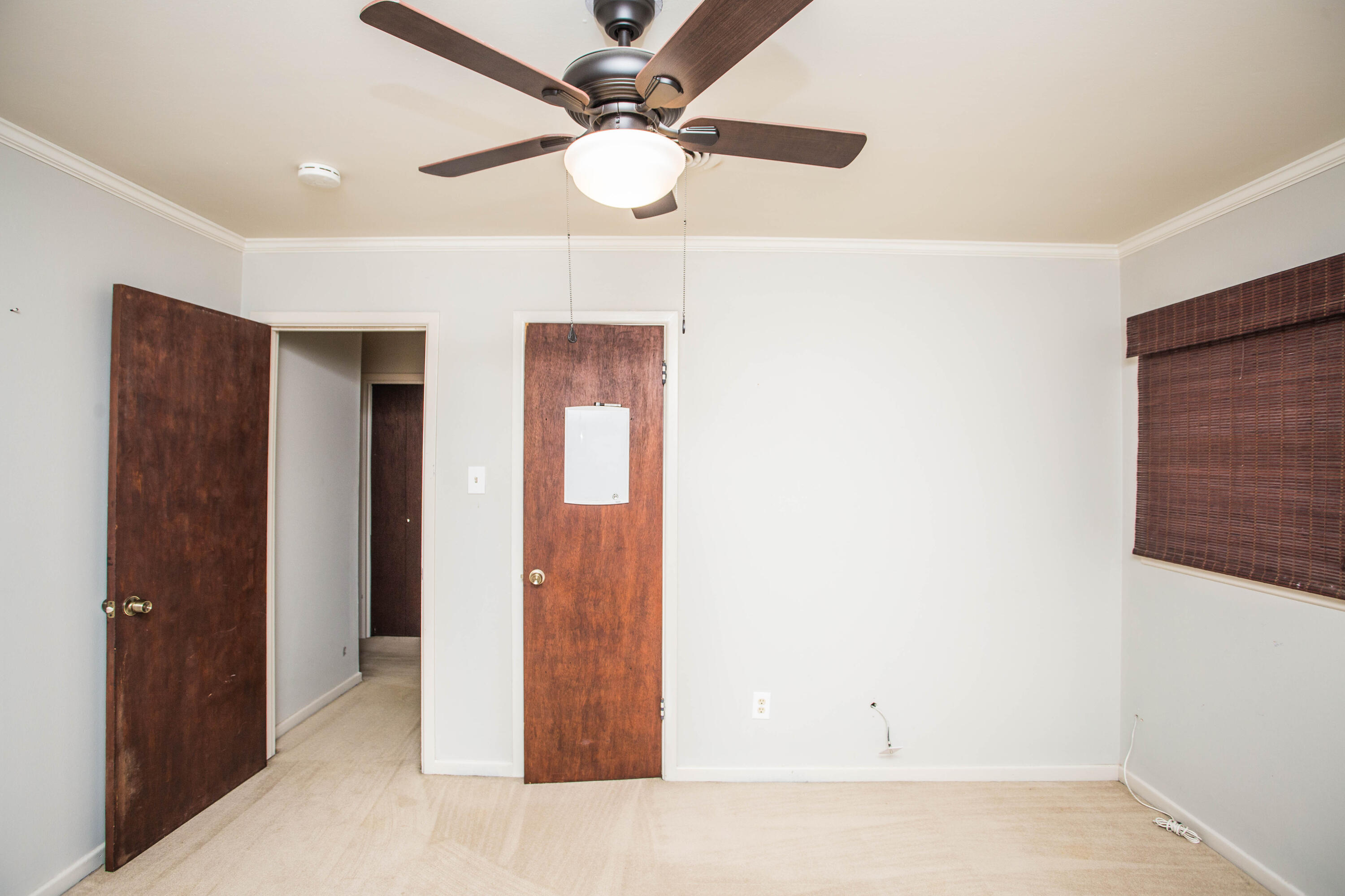4932 9th Street Lubbock, TX 79416 - Photo 24 of 29 a view of a hallway with a ceiling fan