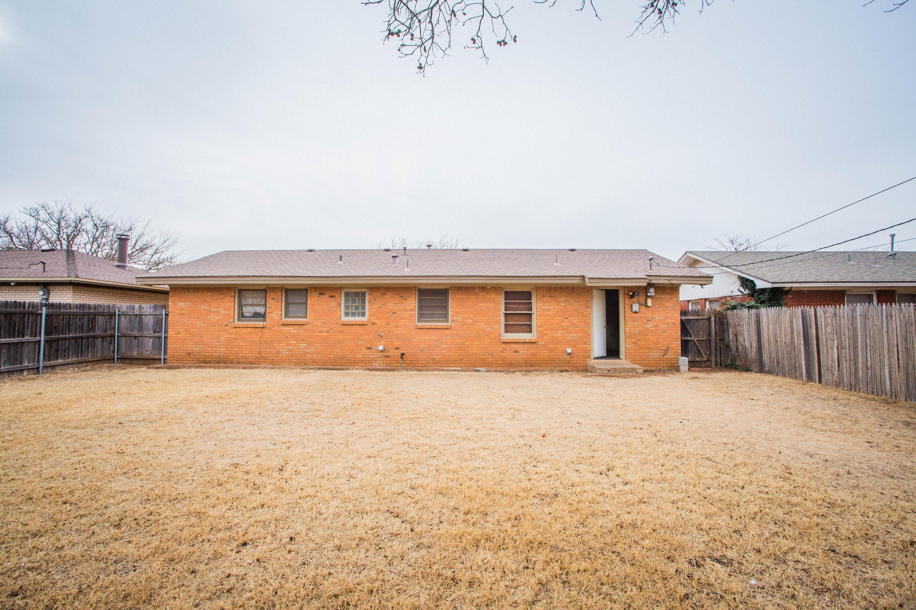 4932 9th Street Lubbock, TX 79416 - Photo 29 of 29 a view of a yard in front of a house with a large window