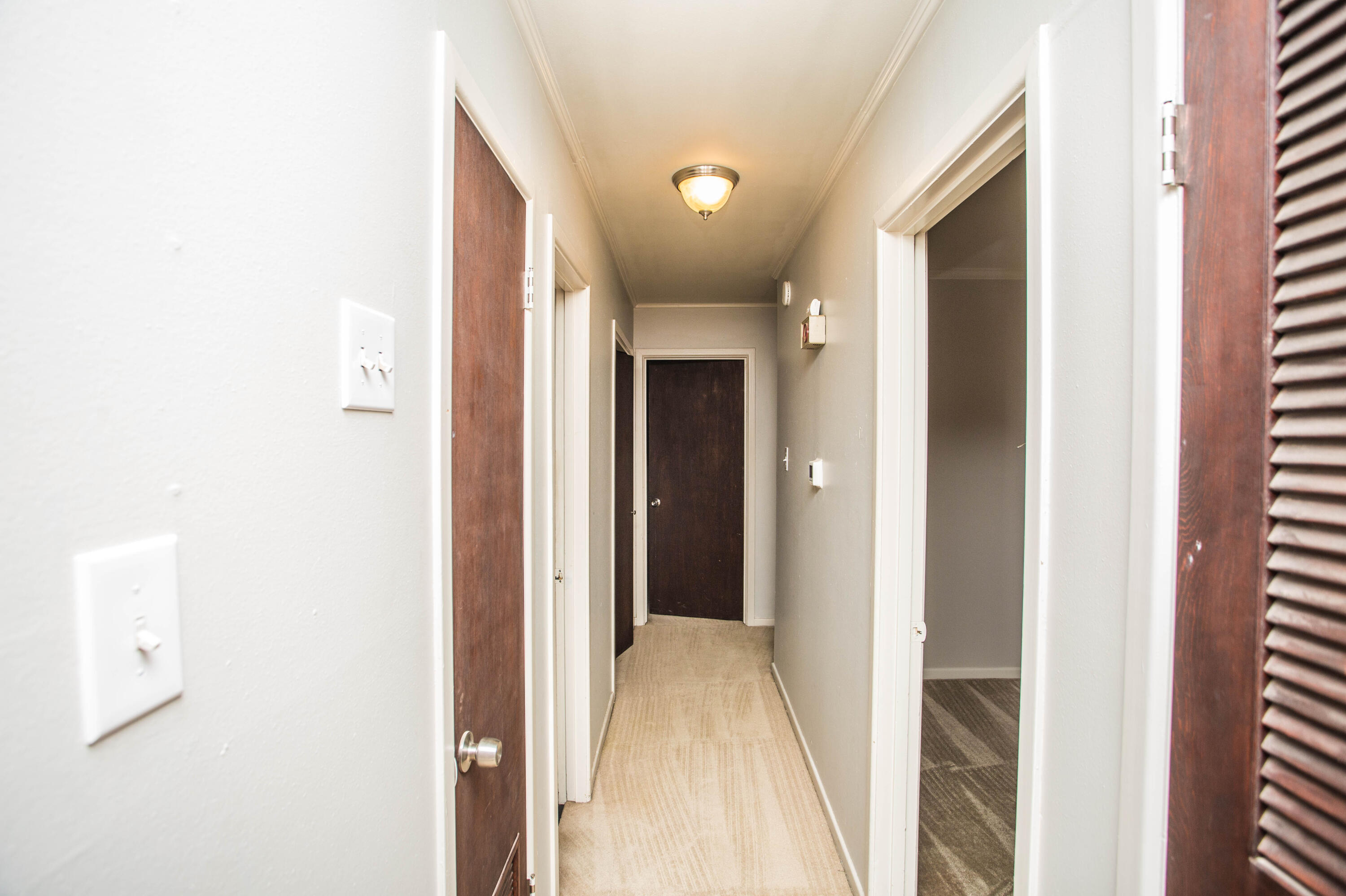 4932 9th Street Lubbock, TX 79416 - Photo 10 of 29 a view of a hallway with closet