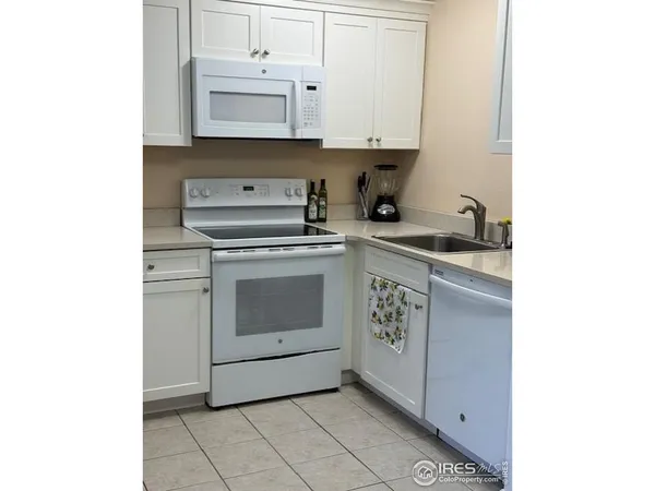 a kitchen with a stove and a sink