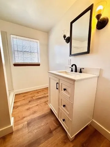 a bathroom with a sink and a mirror