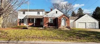 a house view with a backyard space