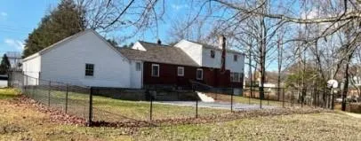 a view of a house with a yard and garage