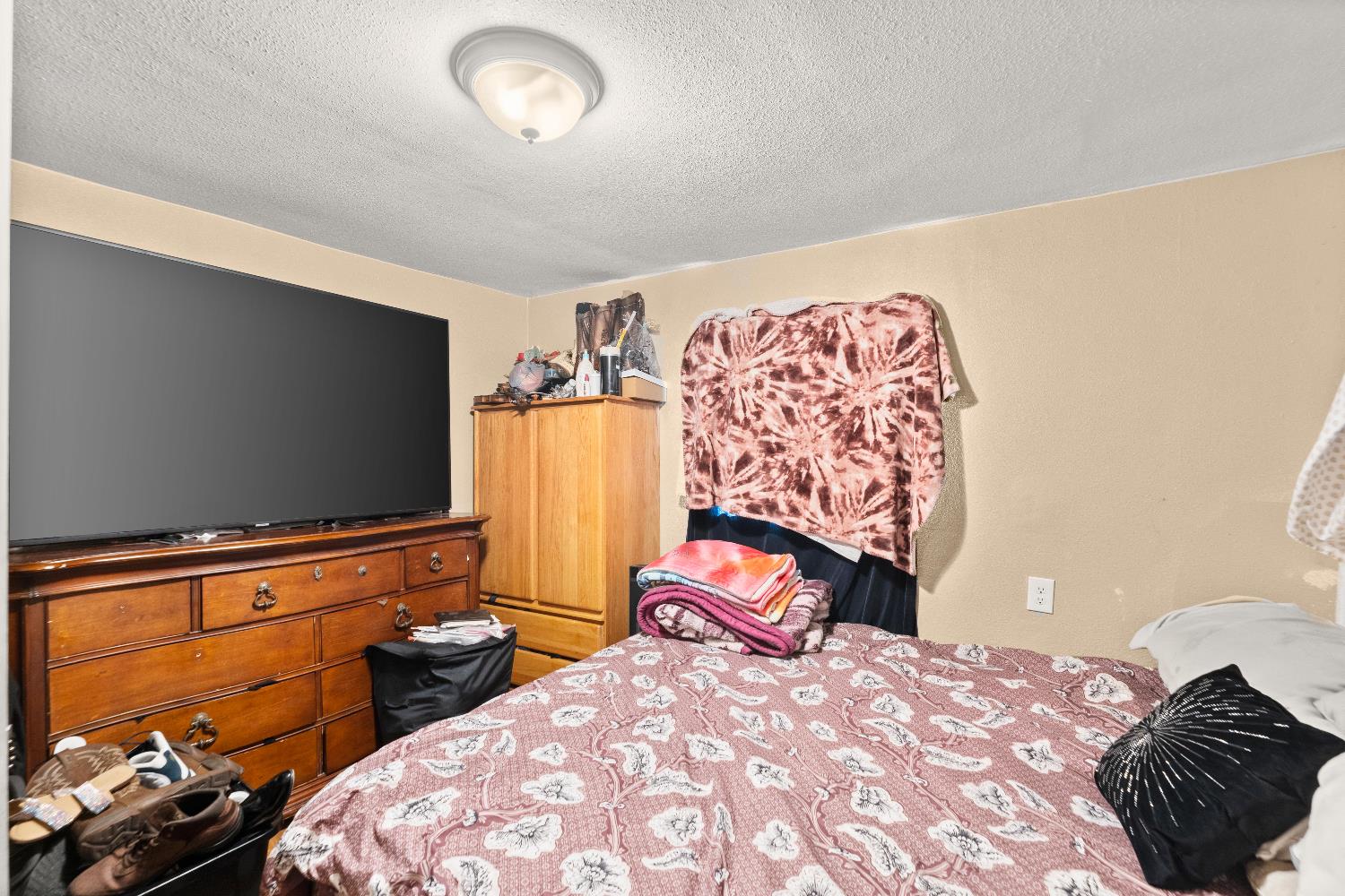 710 Glide Avenue, Unit 66 West Sacramento, CA 95691 - Photo 12 of 12 a bedroom with a bed and tv