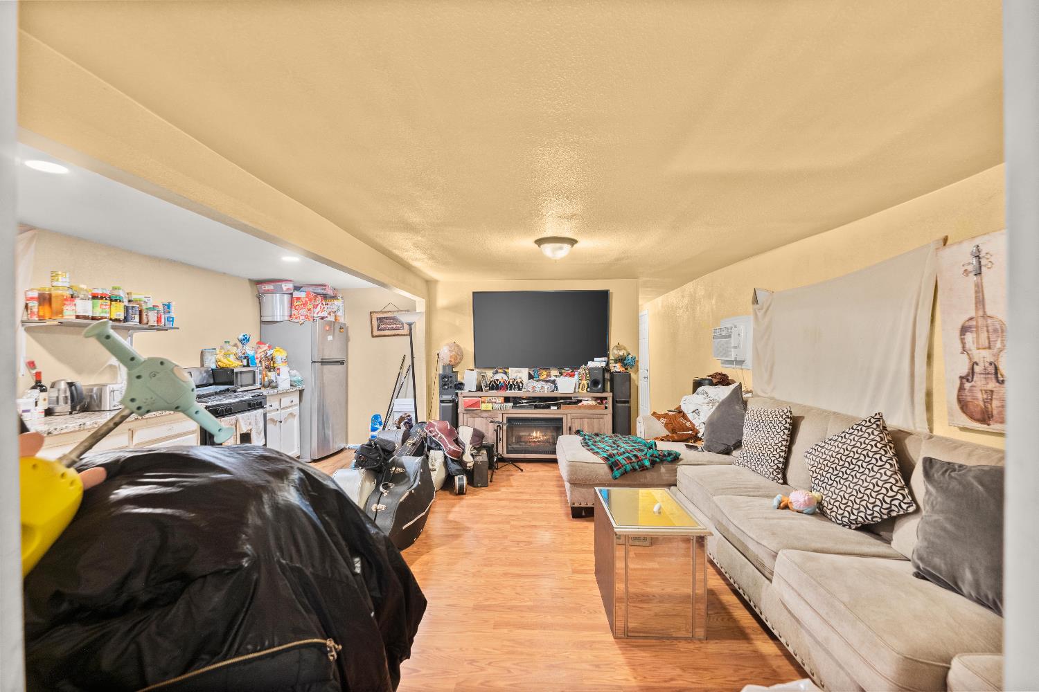 710 Glide Avenue, Unit 66 West Sacramento, CA 95691 - Photo 8 of 12 a living room with furniture and a flat screen tv