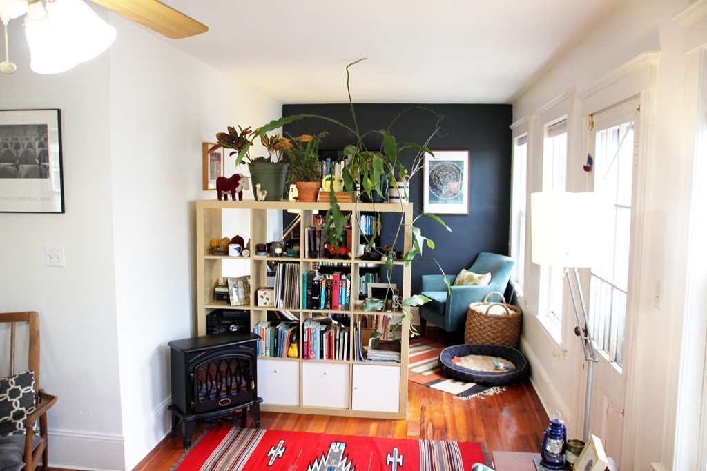 80 Aldrich Street, Unit 2 Boston, MA 02131 - Photo 11 of 20 a living room with furniture a rug and a potted plant