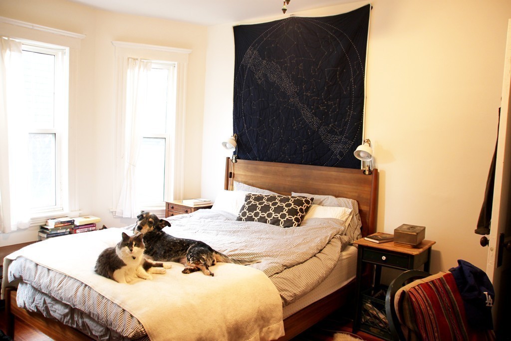 80 Aldrich Street, Unit 2 Boston, MA 02131 - Photo 14 of 20 a bedroom with a bed and a dresser